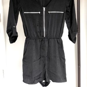 Black satin zip-up romper with pockets
